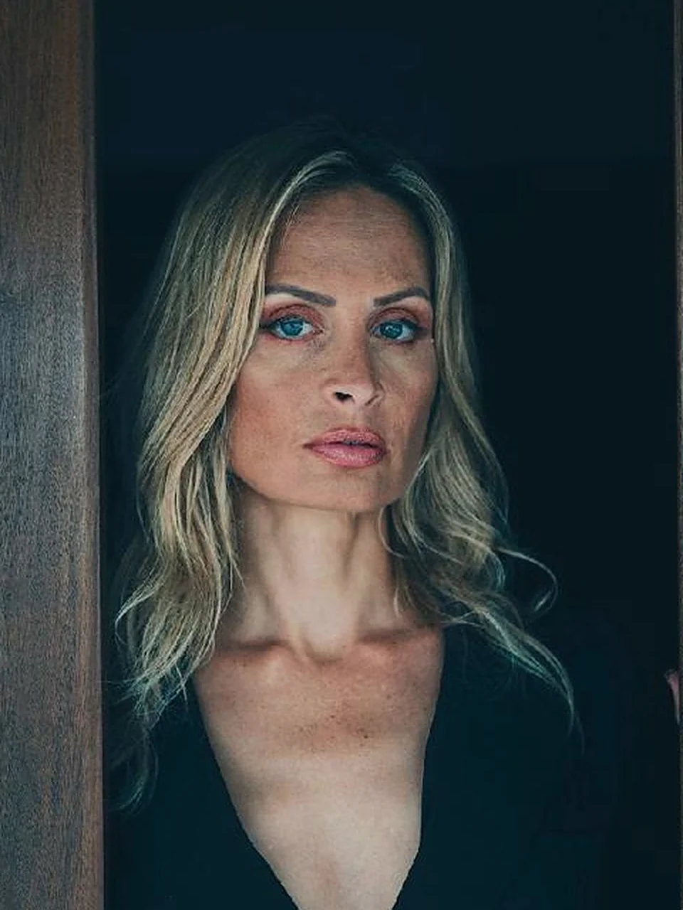 Portrait of Anastasia Ramlall in a wooden doorway in Mauritius
